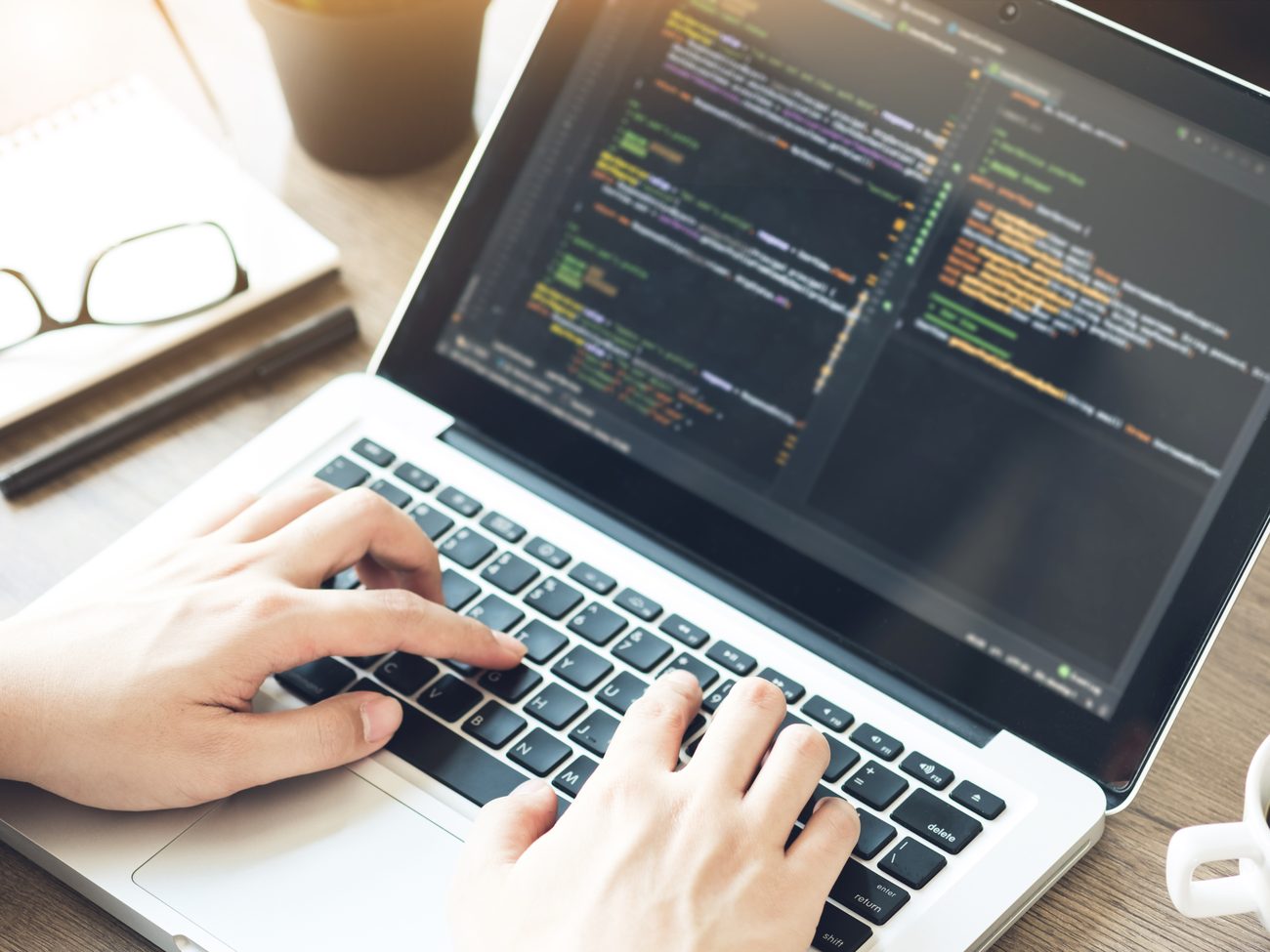 Engineer developing software at a workstation